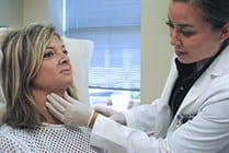 Dr. Polder working on a patient's chin