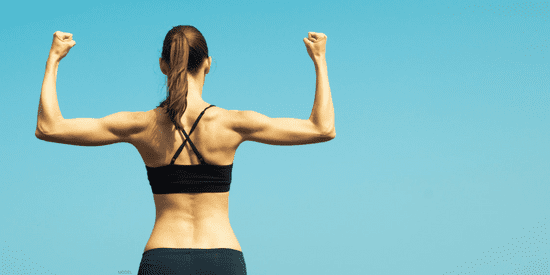 Women from back flexing arms to show off back muscles