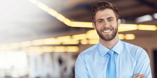 Handsome man in dress shirt and blue tie