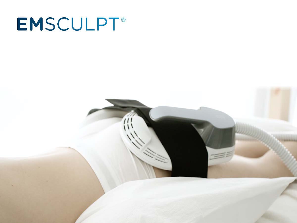 Woman receiving an EMSCULPT treatment on her buttocks