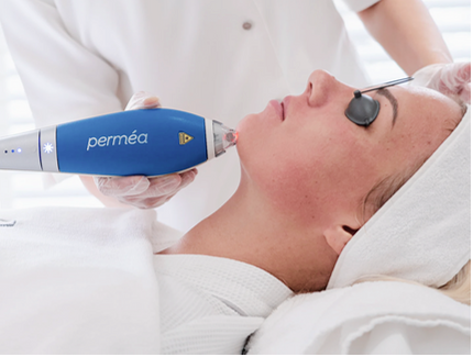 woman receiving treatment while wearing eye covers.