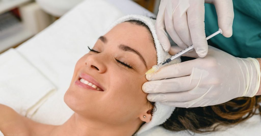 Woman receiving Dysport injection (models)